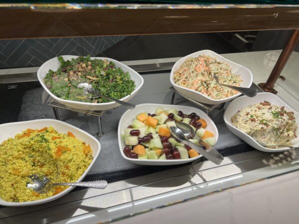 Cold salads including fruit salad, couscous, and a unique and delicious loaded potato salad.