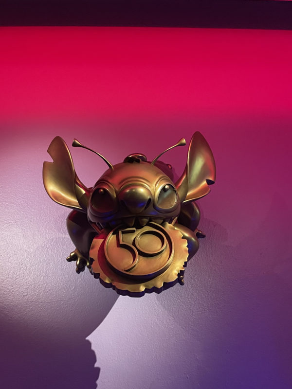 Stich (12) is "hanging out" in Tomorrowland! Can you find him?