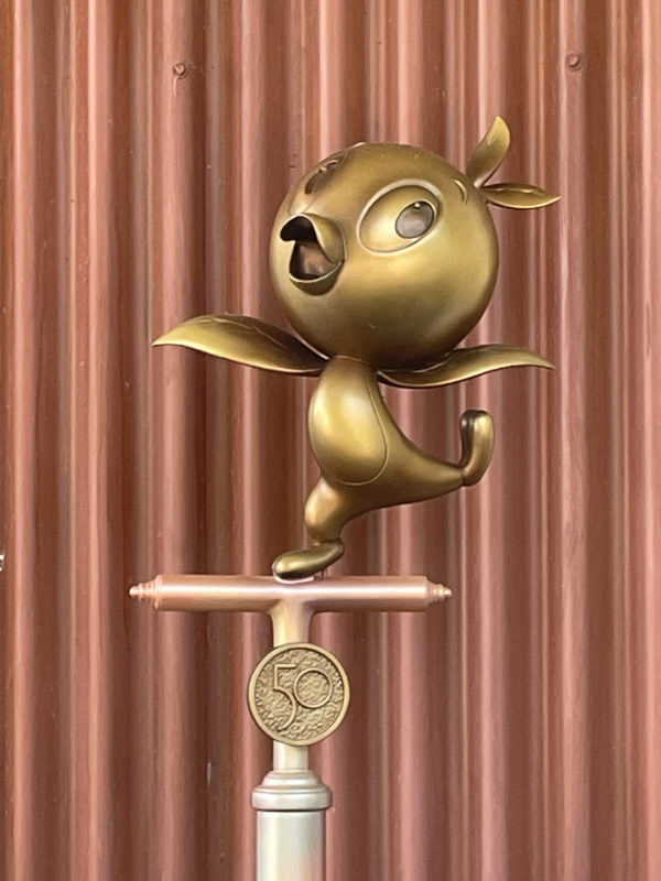 The Orange Bird (25) is perched on a unique pedestal in Adventureland!