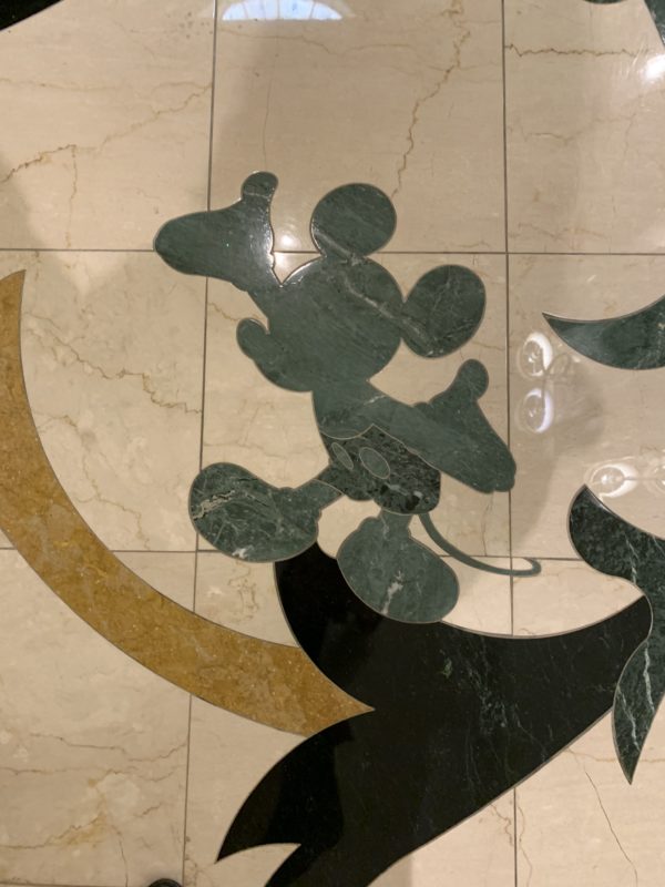Mickey Mouse in the tile on the second floor as you enter the hotel from the monorail.