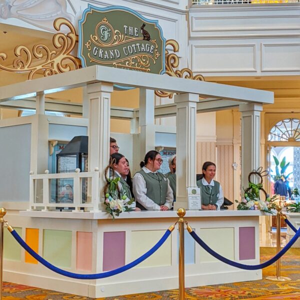 Cast Members pose inside the new Grand Cottage