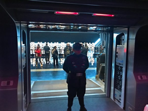 A First Order Patrol officer is standing at the door as it opens and informs you that you are now prisoners of the First Order and demands that you get off your ship. 