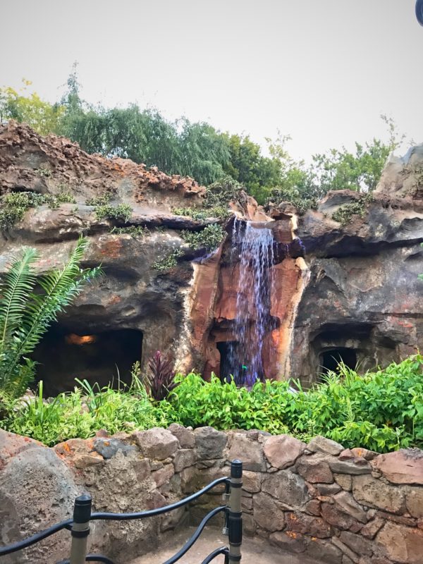 It looks like the waterfall has worn the rock out over time.