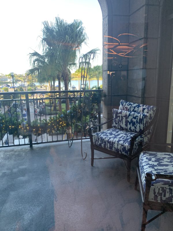 Off of the lobby, you’ll find this inviting balcony overlooking the activity lawn and leisure pool and the beautiful waters of Barefoot Bay.