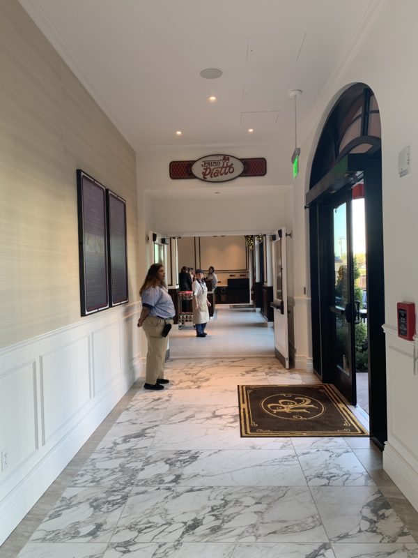 The common areas feature beautiful marbled floors, bright but natural hues, plenty of natural light, and helpful signage.