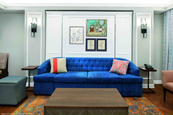 The artwork above the couch (which turns into a Murphy bed) in the living room of the one-bedroom villa includes a painting of some of your favorite Beauty and the Beast Characters as well as a couple sketches. Can you spot Minnie Mouse? Photo credits (C) Disney Enterprises, Inc. All Rights Reserved