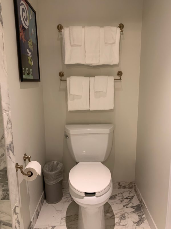 The bathroom areas are separated by walls in the deluxe studio for added privacy.