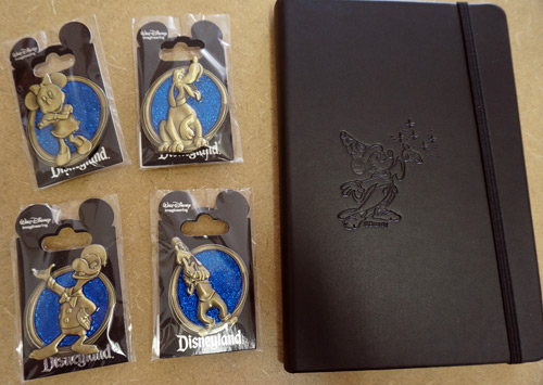 One lucky winner will get all four pins and the notebook!