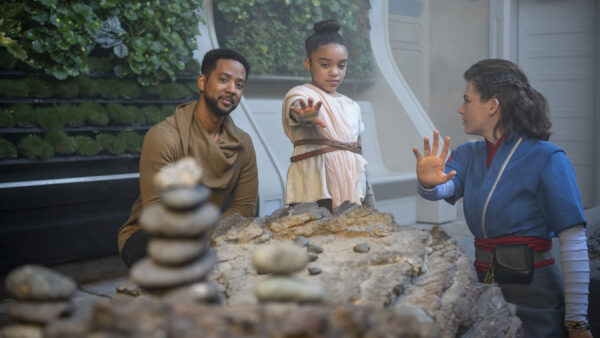 A Saja (right) helps a young <em>Halcyon</em> starcruiser passenger tap into the Force in Star Wars: Galactic Starcruiser at Walt Disney World Resort in Lake Buena Vista, Fla. (Matt Stroshane, photographer) Photo credits (C) Disney Enterprises, Inc. All Rights Reserved 