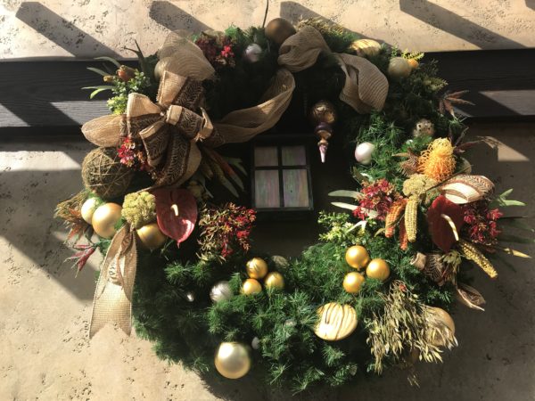 You can find Christmas details in many places.  This beautiful wreath is on the side of the ticket booths.