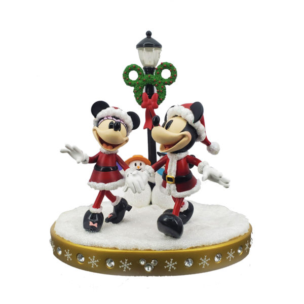 Light-up figurine of Mickey and Minnie strolling through the snow. Photo credits (C) Disney Enterprises, Inc. All Rights Reserved 