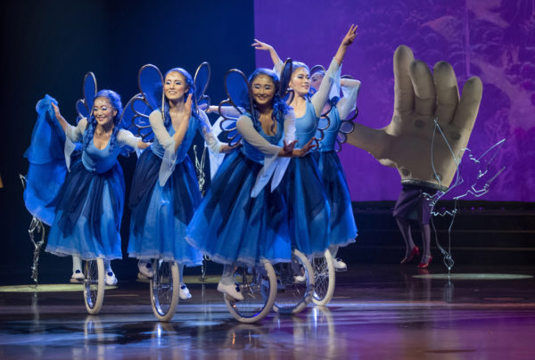 Five playful unicyclists representing the Blue Fairy from the classic Disney Animation film “Pinocchio” appear to effortlessly float across the stage during Drawn to Life, the highly anticipated new collaboration from Cirque du Soleil and Disney. The show premiered on Nov. 18, 2021, at Walt Disney World Resort in Lake Buena Vista, Fla. (Kent Phillips, photographer). Photo credits (C) Disney Enterprises, Inc. All Rights Reserved 