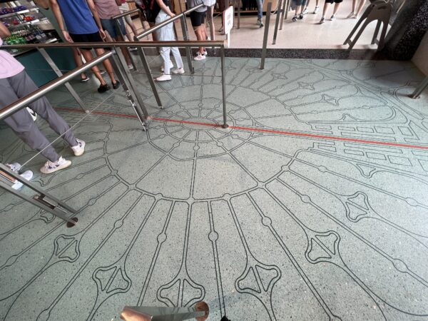 The floor pays homage to the original map design for EPCOT the city.