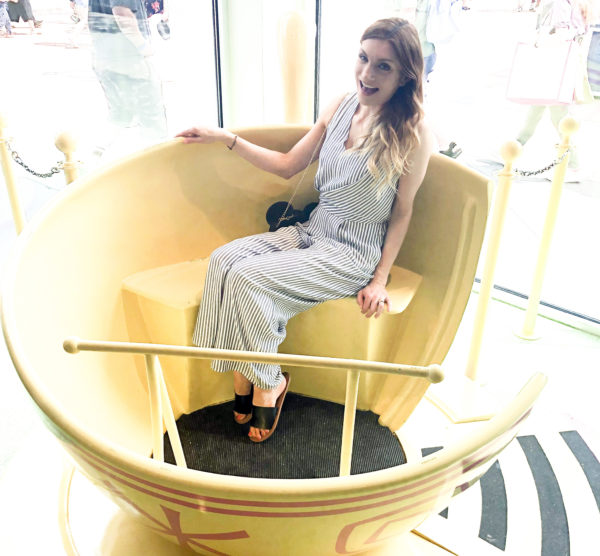 Smiling in a Tea Cup inside the DisneyStyle store in Disney Springs West Side. 
