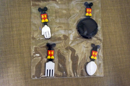 Mickey-inspired magnets of cooking utensils. 