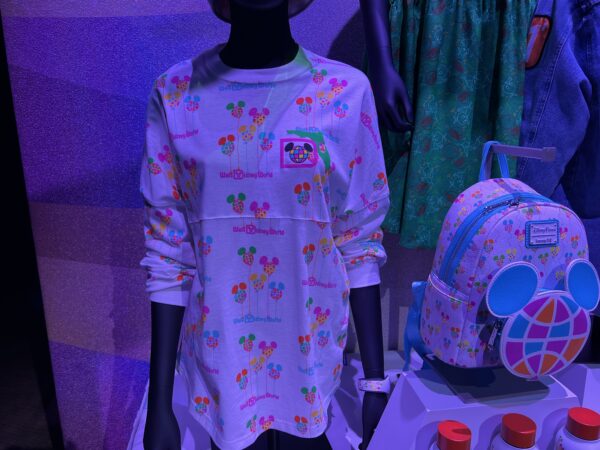 Modern cut shirt with Disney print that was put on paper merchandise bags in 1971.