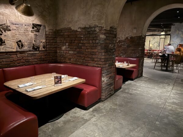 Enjoy the drinks in a fun environment themed after Prohibition-era bars.