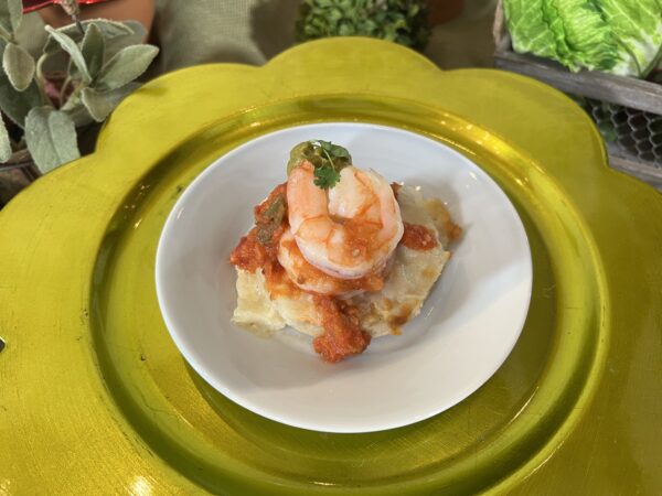 Arepa topped with Shrimp, Crushed Avocado Aji, and Tomato Sauce