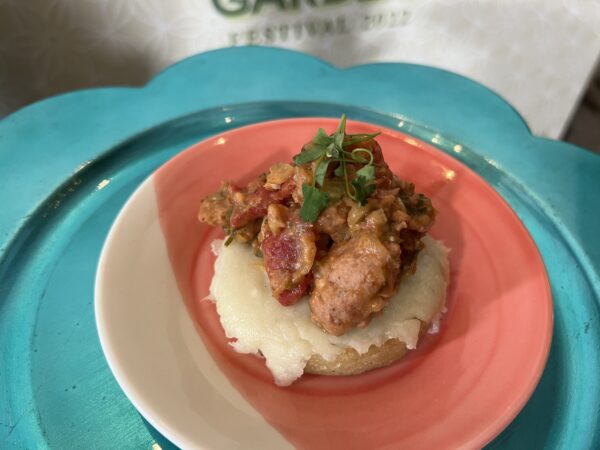 Arepa (corn cakes made from special precooked corn flour) topped with Chroizo