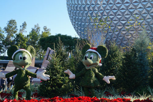 Mickey and Minnie Mouse topiaries at the park entrance.