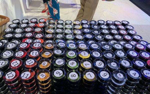 Get a numbered cup of paint and a paint brush.