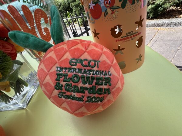 Once the plush is turned inside out, it looks like a Spaceship Earth inspired orange with the Festival logo.