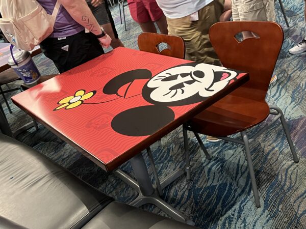 Colorful tables in the Passholder Lounge in The Land Pavilion.