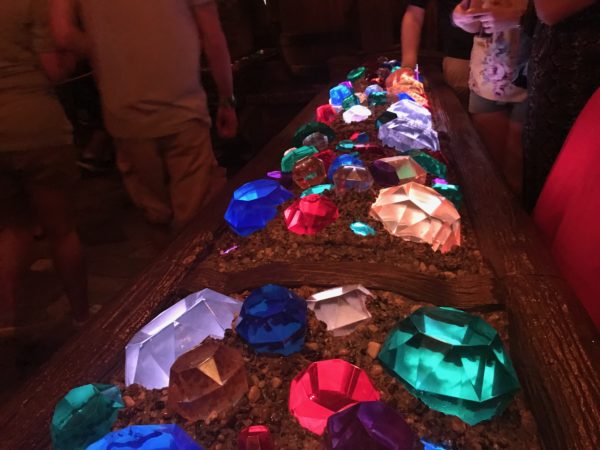 When the ride opened, this area was an interactive gem-sorting game, but it has since been replaced with this gem trough.