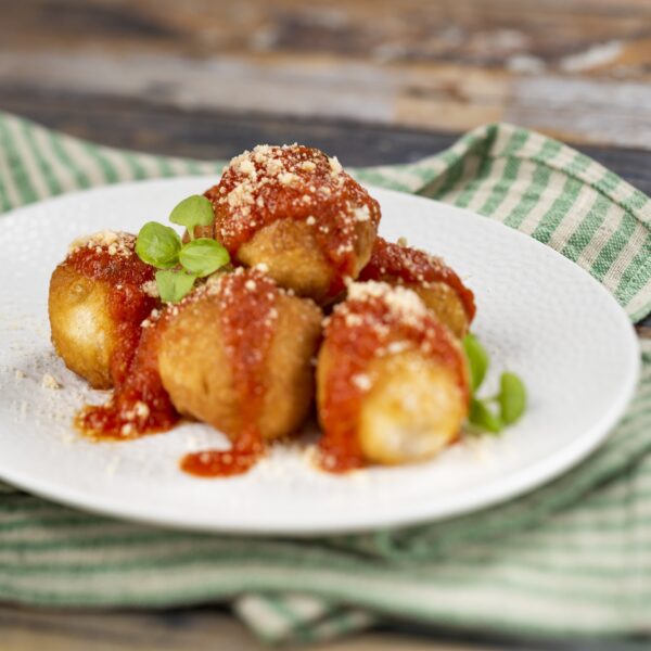 Montanara: Fried house-made pizza dough with pomodoro sauce, Parmesan, and fresh basil