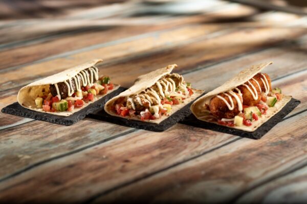 Moroccan Wrap with tomato-cucumber relish and garlic sauce served on warm Moroccan flatbread