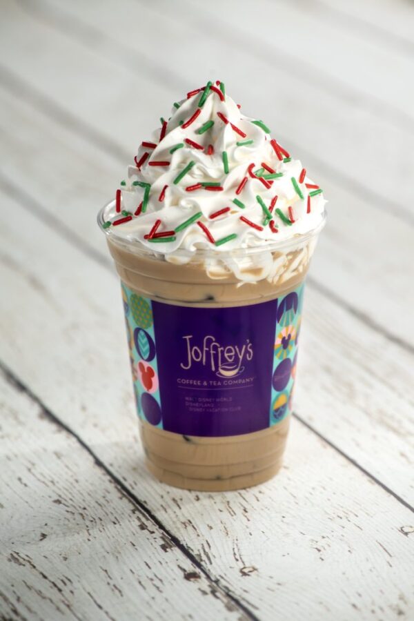 Holiday Cookie Latte: Espresso, caramel sauce, almond syrup, and choice of milk topped with whipped cream and merry sugar sprinkles (Non-alcoholic) (New) (Spirited version available with Baileys Original Irish Cream Liqueur)