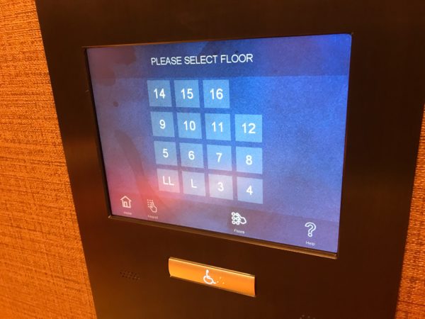 Select your desired floor on the elevator touch screen.
