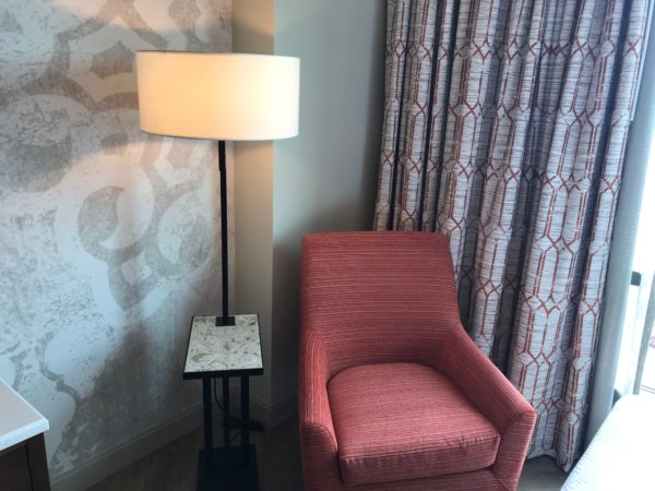 The colors and textures in the room fit the theme of the resort, but in a modern way.