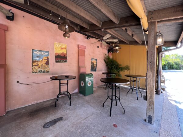 Shaded outdoor seating area at The Den of Destiny. 