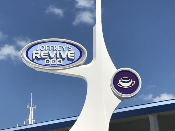 The signs for Joffrey's Revive coffee kiosk take their inspiration from early Tomorroland design.