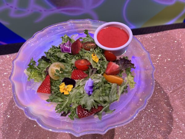 The Sun Bonnet Trio salad. Mixed green salad with strawberries, tomato, red onion, and edible flowers. Available at Pecos Bill Tall Tail Inn and Café.
