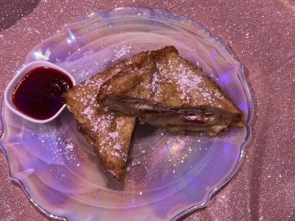 Monte Cristo Sandwich. Bacon, roasted turkey, and provolone dipped in funnel cake batter and deep-fried, sprinkled with EARidescentsugar with housemaid strawberry jam. Available at The Plaza Restaurant