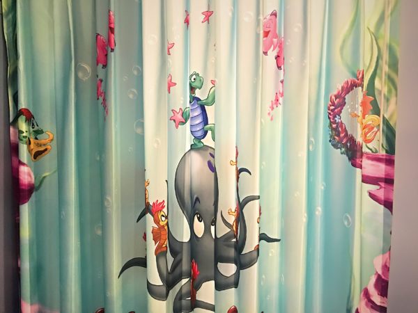 The curtain provides some privacy for the sink.