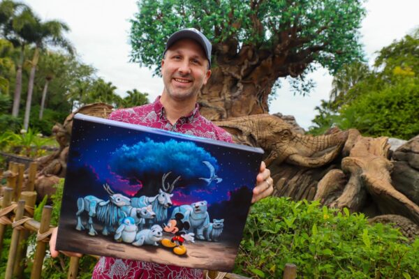 Artist Rob Katz and his Merry Menagerie art piece at Animal Kingdom
