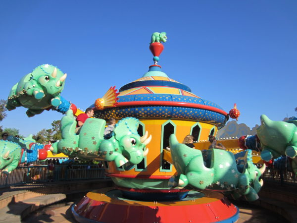 Triceratop Spin is a pretty standard aerial carousel ride and not worth waiting for. 