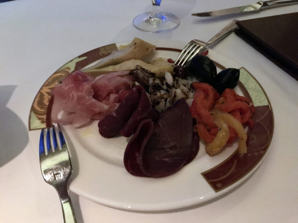 The antipasti salad is plated beautifully.