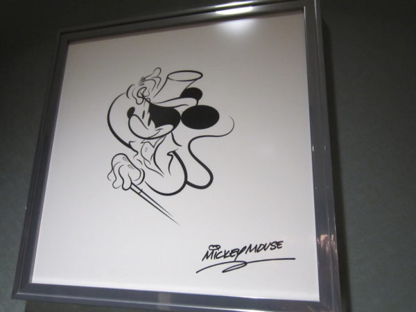 Share a Dream Come True began with an animator sketching Mickey Mouse.