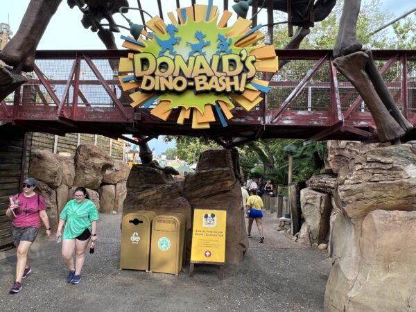 As you approach Dinoland, you will see a yellow sign about the passholder magnet distribution.