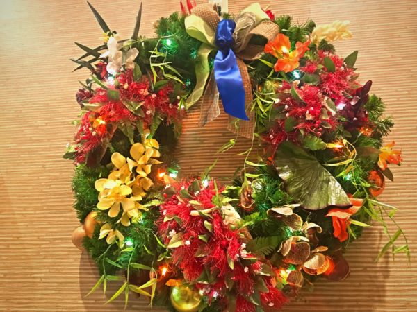 Check out this delightful wreath full of beautiful Hawaiian flowers. 