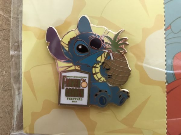 Stitch looks relaxed drinking from his pineapple.