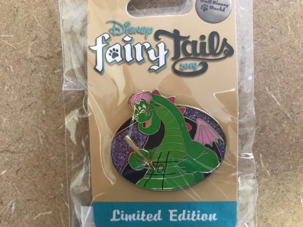 Pete's Dragon trading pin featuring Elliot playing tic-tac-toe on his tummy.