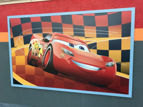 Lightning McQueen's Racing Academy poster in the courtyard.