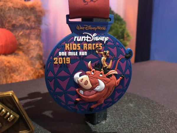 Pumba and Timon appear on this runDisney Kids Races One Mile Run medal. It's actually a rubbery material perfect for kids!
