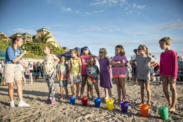 A Cast Member at Disney’s Vero Beach Resort teaches young guests about the importance of recycling during the annual Tour de Turtles event. Photo credits (C) Disney Enterprises, Inc. All Rights Reserved