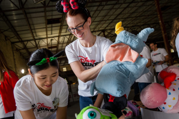 Cast Members volunteers sort and organize the donations. Photo credits (c) Disney Enterprises, Inc. All Rights Reserved